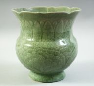 A CHINESE CELADON GLAZE PORCELAIN VASE, with incised decoration under glaze, (af), 18cm high.