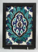 A 17TH CENTURY OTTOMAN DAMASCUS FRAMED TILE, painted with floral design, overall 24cm x 18cm.