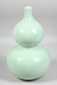 A GOOD LARGE CHINESE CELADON GLAZE DOUBLE GOURD VASE, the base with six-character mark. 33.5cm high