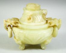 A CHINESE CARVED GREEN HARDSTONE TWIN HANDLE KORO AND COVER, carved with temple lions and ring
