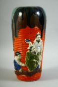 A JAPANESE SUMIDA POTTERY VASE, decorated in relief with figures, 29.5cm high.
