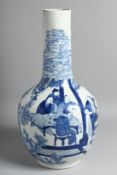 A LARGE CHINESE BLUE AND WHITE PORCELAIN BOTTLE VASE, painted with figured around a table, as well