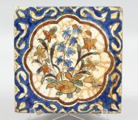 A 16TH/17TH CENTURY PERSIAN SAFAVID KUBACHI TYPE GLAZED POTTERY TILE, painted with a central