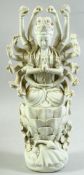 A DEHUA PORCELAIN MULTI ARMED FIGURE OF DOUMU, seated in dhyanasana upon a lotus throne, 40.5cm