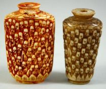 TWO CARVED BONE SCENT BOTTLES, carved with multiple faces, 6.5cm and 6cm.