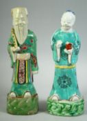 A PAIR OF 18TH CENTURY CHINESE PORCELAIN IMMORTAL FIGURES, 23cm and 22.5cm high.