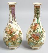 A SMALL PAIR OF JAPANESE SATSUMA PORCELAIN BOTTLE VASES, painted with birds and native flora with