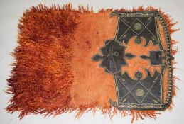 A GOOD TURKOMAN OR KURDISH WOOL AND LEATHER SADDLE, with metal thread embroidered decoration.