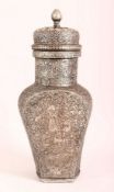 A GOOD PERSIAN TINNED COPPER LIDDED URN - the body carved with figures, animals, and flora, with a