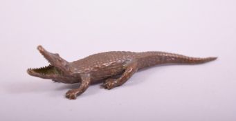 A SMALL JAPANESE BRONZE MODEL OF AN ALLIGATOR, 8.5cm long.