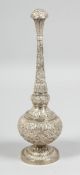 A GOOD INDIAN SILVER ROSEWATER SPRINKLER, with embossed and chased foliate decoration all over, 23cm