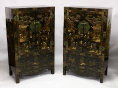 A PAIR OF CHINESE BLACK LACQUER HARDWOOD CABINETS, the hinged doors opening to reveal a central