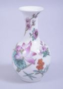 A 20TH CENTURY CHINESE REPUBLIC STYLE SMALL PORCELAIN VASE, decorated with flora and butterflies,