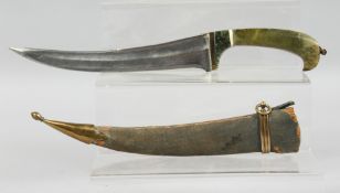 AN INDIAN JADE HANDLED DAGGER, with curving blade and wooden sheath, 35cm long overall.