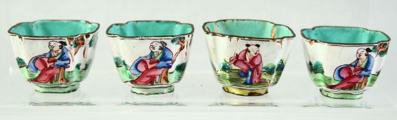 FOUR CHINESE ENAMELLED SALTS, each decorated with figures in an outdoor setting, 4.5cm diameter, (