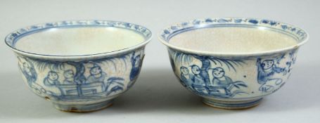 A PAIR OF CHINESE BLUE AND WHITE PORCELAIN BOWLS, each painted with figures, 14cm diameter.