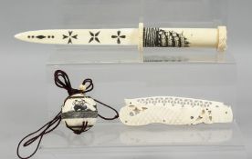 A COLLECTION OF THREE CARVED BONE PIECES, comprising two nautical items including a carved ball