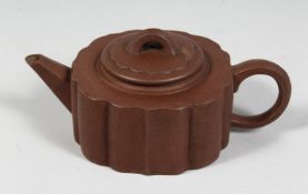 A CHINESE YIXING TEAPOT with impressed mark to inner lid and base. 16.5cm (spout to handle)