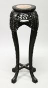 A CHINESE HARDWOOD AND MARBLE INSET CIRCULAR VASE STAND, with pierced and carved frieze and
