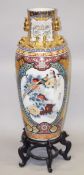 A LARGE CHINESE FLOOR STANDING PORCELAIN VASE on a hardwood stand, decorated in Japanese style