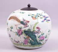 A LARGE CHINESE FAMILLE VERTE PORCELAIN JAR WITH WOODEN COVER, the jar painted with phoenix and