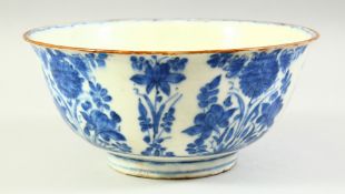 A PERSIAN SAFAVID BLUE AND WHITE GLAZED POTTERY BOWL, the exterior with sprays of foliate
