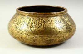 A GOOD ISLAMIC ENGRAVED BRASS BOWL, with panels of engraved calligraphy and emblems depicting a