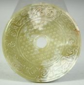 A LARGE CHINESE CARVED NEPHRITE JADE ARCHAIC DISK, 12.5cm.