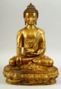 A GOOD LARGE TIBETAN GILT BRONZE BUDDHISTIC STATUE, the seated figure holding a censer. 33cm high