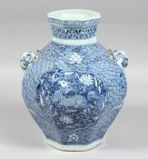 A CHINESE BLUE AND WHITE PORCELAIN OCTAGONAL TWIN-HANDLED VASE, each side decorated with a panel