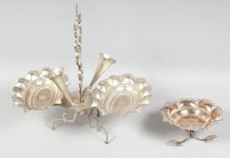 AN IRAQI WHITE METAL CENTREPIECE, 35cm long, together with a similar footed dish, (2).