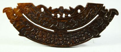 A CARVED HARDSTONE ARCHAIC AMULET, 15.5cm long.