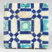 AN TURKISH BLUE, WHITE AND TURQUOISE GLAZED POTTERY TILE, 23cm square.