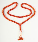 A STRING OF GLASS PRAYER BEADS, 60cm end to end