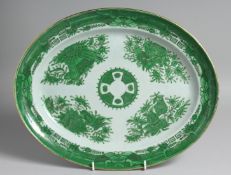 A CHINESE EXPORT PORCELAIN GREEN FITZHUGH OVAL-SHAPED DISH decorated with flora, objects, and