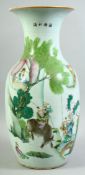 A LARGE CHINESE PORCELAIN VASE, painted with a figure riding an oxen together with other figures