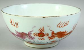 A CHINESE CORAL RED AND WHITE PORCELAIN DRAGON BOWL, the exterior with dragons and the flaming pearl