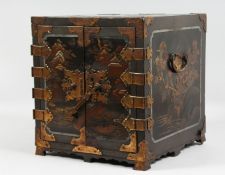 A JAPANESE MEIJI PERIOD BLACK LACQUER TABLE CABINET, the doors opening to reveal seven lacquered