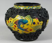 A LARGE CHINESE RELIEF DECORATED FAHUA VASE, the polychrome panels decorated with fish and algae.
