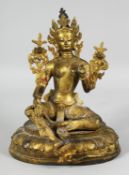 A TIBETAN GILT BRONZE BUDDHA seated upon an oval-formed base. 25cm high