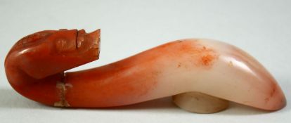 A CHINESE CARVED HARDSTONE BELT HOOK, 10cm long.