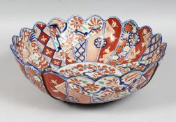 A LARGE 19TH CENTURY JAPANESE IMARI BOWL, with petal form rim, 31cm diameter.