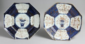 A PAIR OF CHINESE BLUE AND WHITE OCTAGONAL PORCELAIN DISHES, with gilt foliate decoration. 25cm at