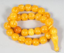 A STING OF AMBER STYLE BEADS AND TOGGLE.