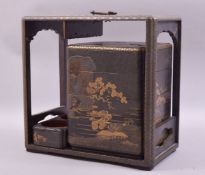 A 19TH CENTURY JAPANESE LACQUER PICNIC BOX with gilt decoration, the box containing four stacking