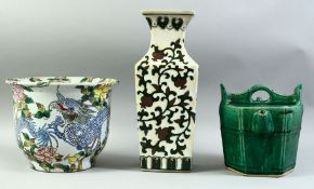 A CHINESE GREEN GLAZED POTTERY WATER JUG, together with dragon and floral decorated jardiniere and a