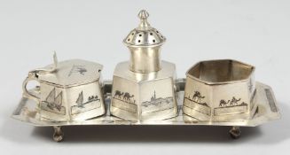 AN IRAQI SILVER NIELLO SILVER FOUR PIECE CRUET SET, (4).