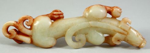 A CHINESE CARVED JADE / HARDSTONE FIGURE of a chilong dragon, 17cm long.