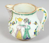 A SMALL TURKISH KUTAHYA POTTERY JUG, decorated with figures, 9.5cm high.