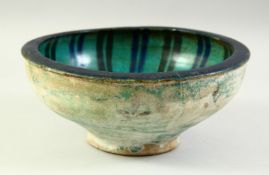A PERSIAN SAFAVID TURQUOISE-GLAZED POTTERY BOWL, the interior with striped decoration, the
